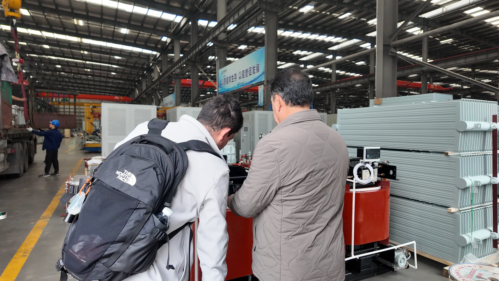International customer inspecting SF6 switchgear at the factory