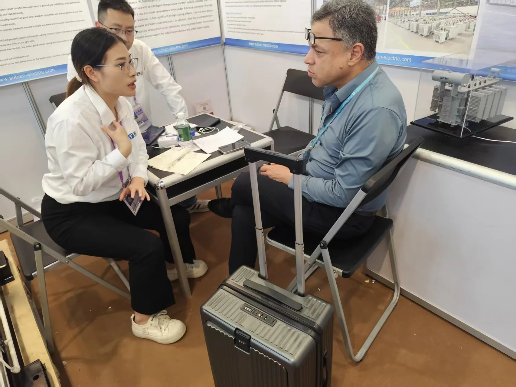 Subian sales representative discussing a project with a visitor